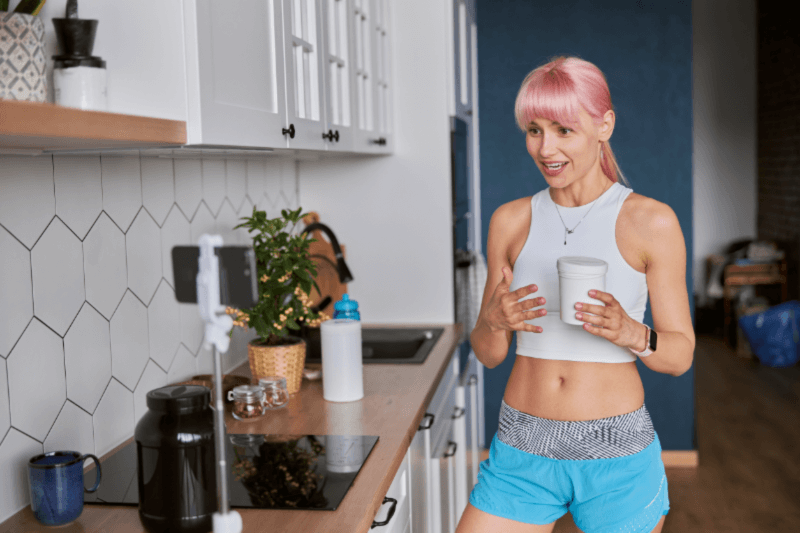health and wellness influencer shows off a product to a video phone
